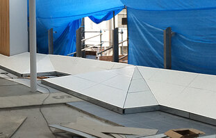 Empty metallic structure of the green bench covered by thin rigid sheets, Shin Yamaguchi station