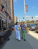 Jane Schulak and Patrick Blanc walking in the streets, Detroit, July 2016