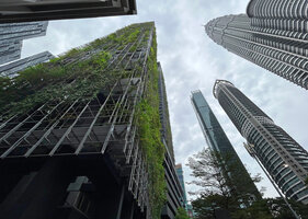 Le Nouvel towers covered with climbers by Patrick Blanc and Petronas Towers, Kuala Lumpur, April 2023