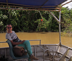 Pascal Héni and Mucuna bennettii flowering along the banks of the Karawari river, Sepik, Papua New Guinea, March 2016