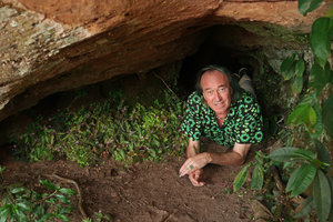 Patrick Blanc alongside a dense flowering population of the tiny Sonerila harmandii under a rock shelter, Phu Hin Rong Kla NP, Phitsanulok, Thailand, Nov. 2018