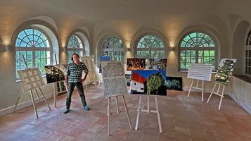 Patrick Blanc among his works for  his exhibition Trop Belles pour Disparaitre, Serre de la Madone, Menton, France, June 2024