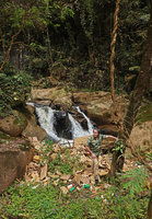 Patrick Blanc among rubbish dumped on the river banks during flash floods, Hang Cop Waterfall, Dalat, Vietnam, Nov. 2019