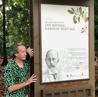 Patrick Blanc and a poster featuring Henry N. Ridley, the Botanist who did dedicate his life to the study of South East Asian plants, Botanic Gardens, Singapore, Nov. 2019