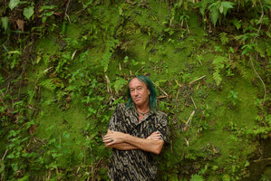 Patrick Blanc and a vertical mossy earth bank partly covered by the tiny Gloxinia erinoides, Minca, Sierra Nevada de Santa Marta, Magdalena, Colombia, Nov. 2016