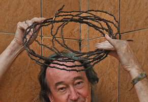 Patrick Blanc and his crown of spines made of a rolled root of  Cercestis blancii, Campo, Cameroon, Sept. 2023