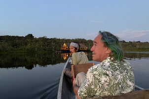 Patrick Blanc and his guide Jarol Fernando Vaca at sunset, arriving at Sacha lodge on Pilchi Cocha laguna, Orellana, Ecuador, Aug. 2021