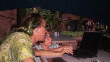 Patrick Blanc and Juliana Prosperi looking at computer to identify some tree species during the Radeau des Cimes, Canopy Raft expedition, Photo AMAP, Phou Hin Poun NBCA, Khammouane, Laos, May 2012