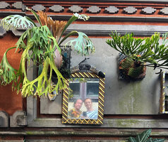 Patrick Blanc and Pascal Héni reflection in an old mirror in the streets of Ubud, Bali, Aug. 2026
