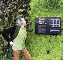 Patrick Blanc and the placard explaining his new botanical concept for the Vertical Garden renovation of the Quai Branly Jacques Chirac Museum, Paris, Dec. 2018