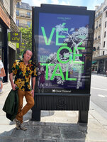 Patrick Blanc and the poster announcing the exhibition Vegetal by Chaumet at Ecole des Beaux Arts, Paris, June 2022