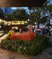 Patrick Blanc at dusk at the GYRE stairs entrance surrounded by his permanent plant installation with native species, Omotesando, Tokyo, Oct. 2023
