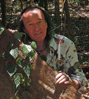 Patrick Blanc behind Piper ornatum, the  pink mottled leaves form, Tangkoko, Sulawesi, Aug. 2015