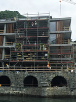 Patrick Blanc checking with the workers the plant installation at Le Sereno, Lago di Como, Italy, June 2016