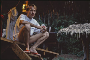 Patrick Blanc drinking the evening beer in the camp, Campo, Cameroon, 1991