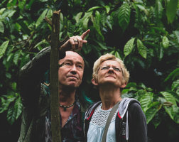 Patrick Blanc explaining to Ulrike Grau the growth habits of Piper nigrum in a pepper and coffee estate, Karnataka, India, June 2018
