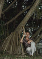Patrick Blanc holding a Pandanus stilt root, Kuala Lumpur, Malaysia, Aug. 1984