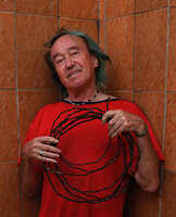 Patrick Blanc holding the coiled 7 m long freely hanging barbed black shiny root of the new Cercestis species, Campo, Cameroon, Sept. 2023