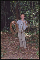 Patrick Blanc holding the long creeping stems of Ipomoea phyllomega, French Guyana, March 1997