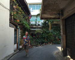 Patrick Blanc in a small soi in front of a heavily pot planted private pocket garden, Bangkok, Jan 2016