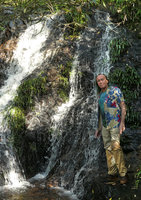 Patrick Blanc in front of a small shaded waterfall whose rocks are covered by the rheophytic Acorus gramineus, Thac Tinh Yeu, Sapa, Vietnam, Nov. 2017