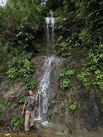 Patrick Blanc in front of a small waterfall covered by Schismatoglottis plurivenia, Taptap, Cebu, Philippines, Dec. 2024