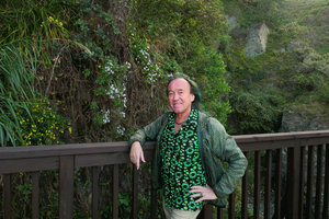 Patrick Blanc in front of Aster spathulifolius on vertical rocks facing the sea, Igidae Park, Busan, South Korea, Oct. 2017