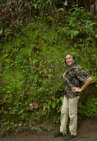 Patrick Blanc in front of a vertical mossy earth bank partly covered by the tiny Gloxinia erinoides, Minca, Sierra Nevada de Santa Marta, Magdalena, Colombia, Nov. 2016