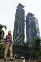Patrick Blanc in front of Le Nouvel towers covered by climbing plants, Kuala Lumpur, Malaysia, Aug. 2016