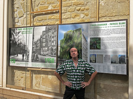 Patrick Blanc in front of the billboard recounting the genesis of his vertical garden Oasis d&#039;Aboukir, Paris, July 2019