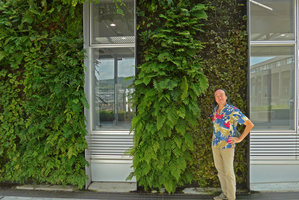 Patrick Blanc in front of the Shinkansen station vertical garden covered by native species such as Arachniodes standishii, Yamaguchi, Japan, Sept. 2016.jpeg