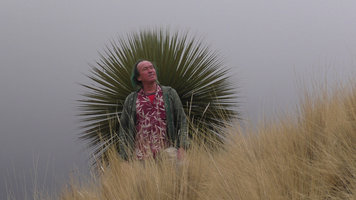 Patrick Blanc in the puna in front of a Puya raimondii vegetative rosette, 4200 m, Turkani, Puno, Peru, Aug 2014