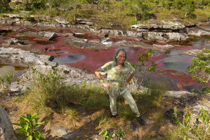 Patrick Blanc just above the deep red Macarenia clavigera, Cano Cristales, Serrania Macarena NP, Meta, Colombia, Oct. 2016