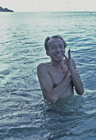 Patrick Blanc laughing and smoking while bathing in the sea, Penang, Malaysia, 1987