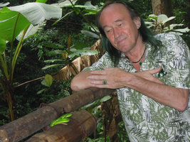Patrick Blanc looking at a quiet green pit viper, Trimeresurus stejnegeri, Xishuangbanna, China, June 2016