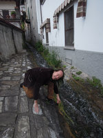 Patrick Blanc looking at a rheophytic individual of Agrostis stolonifera, Como lake, Italy, April 2016