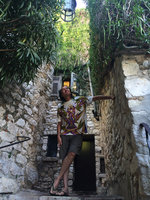 Patrick Blanc looking at the seed pods of Macfadyena unguis-cati, Eze Village, Alpes Maritimes, France, Aug. 2015