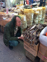 Patrick Blanc looking perpexledly at dried giant tokay geckos, Hong Kong, Dec 2015