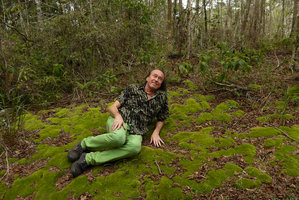Patrick Blanc lying among mosses in Eucalyptus and Casuarina forest, Varirata NP, Papua New Guinea, March 2016