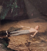 Patrick Blanc lying in a forest stream, Kelantan, Malaysia, Aug. 2003