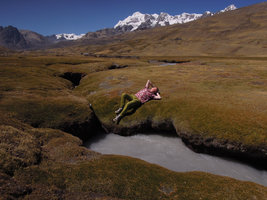 Patrick Blanc lying on the spiny Distichia muscoides peat swamp, Cuzco, 4200m, Peru, Aug 2014