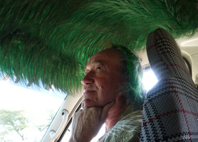 Patrick Blanc much intrigued by the grassy indoor ceiling of a taxi, Arba Minch, Ethiopia, Jan. 2019