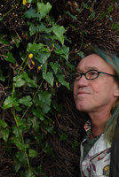 Patrick Blanc observing Aristolochia sempervirens flowers, Saint-Jean-Cap-Ferrat, France, Nov 2015