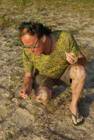 Patrick Blanc observing the leaves of the Ipomoea imperati creeping on a sand beach, Chumphon, Thailand, Dec 2015