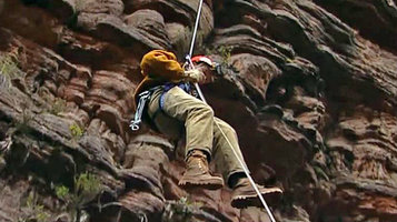 Patrick Blanc on a rope, descending down the 400 m deep chasm, Kukenan Tepui, Venezuela, March 1999