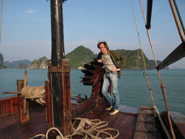 Patrick Blanc on boat in front of tower karst forests, Halong Bay, Vietnam, Jan. 2007
