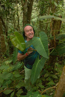 Patrick Blanc partly hidden by a climbing Philodendron, Chicaque, Soacha, Colombia, Oct. 2016