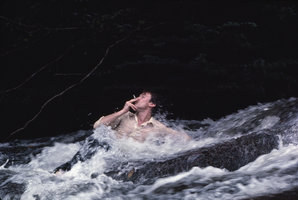 Patrick Blanc smoking and grabbing the rocks such as a rheophyte, Saint George, French Guyana, Feb. 1983