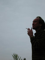 Patrick Blanc smoking at dusk, Halong Bay, Vietnam, Jan. 2007