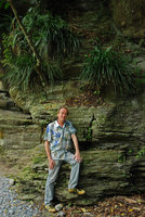 Patrick Blanc under a rock covered by Ophiopogon, Taroko, Taiwan, Dec. 2009